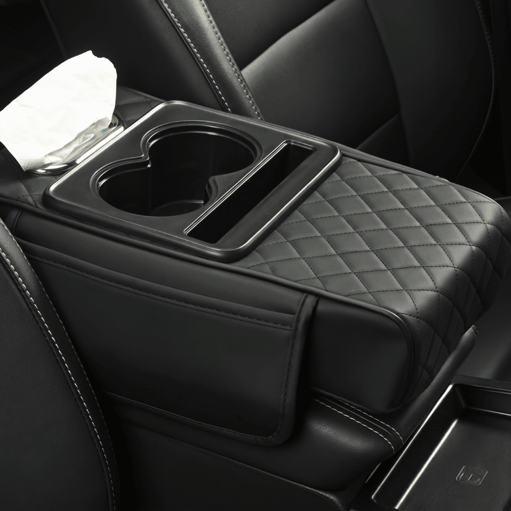 Multifunctional PU Leather Car Armrest Box Mat in a vehicle interior with cup holder and tissue compartment.