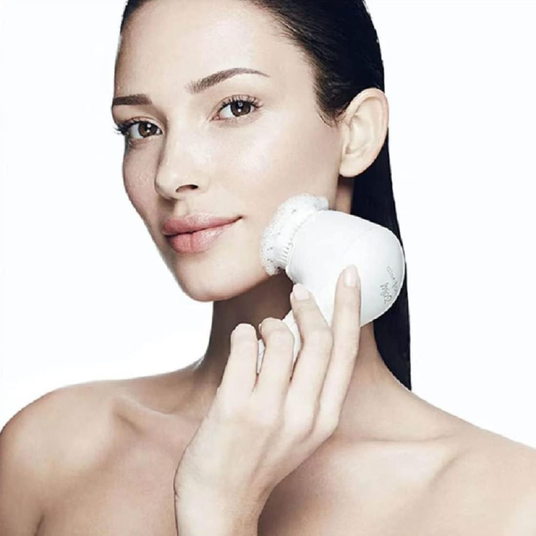 Woman using Sonic Facial Cleansing Brush for deep pore cleansing and healthy skin.
