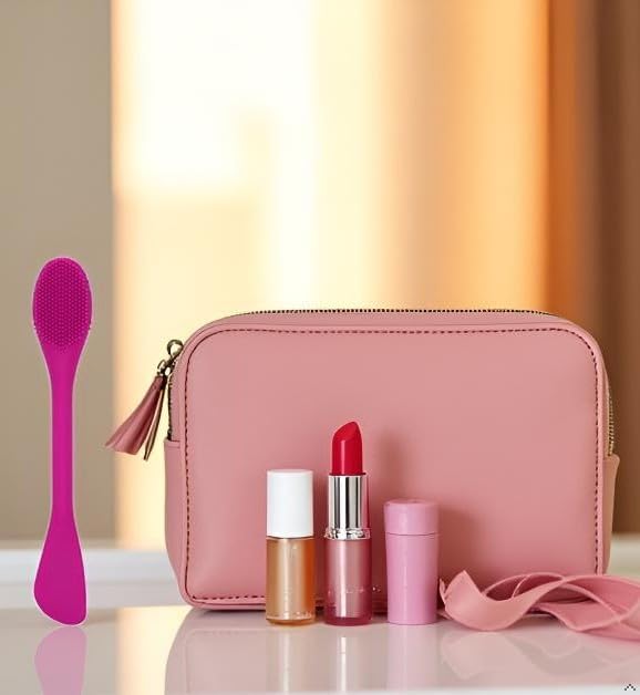 Silicone Facial Cleansing Brush next to cosmetics in a pink makeup bag, showcasing skincare essentials.